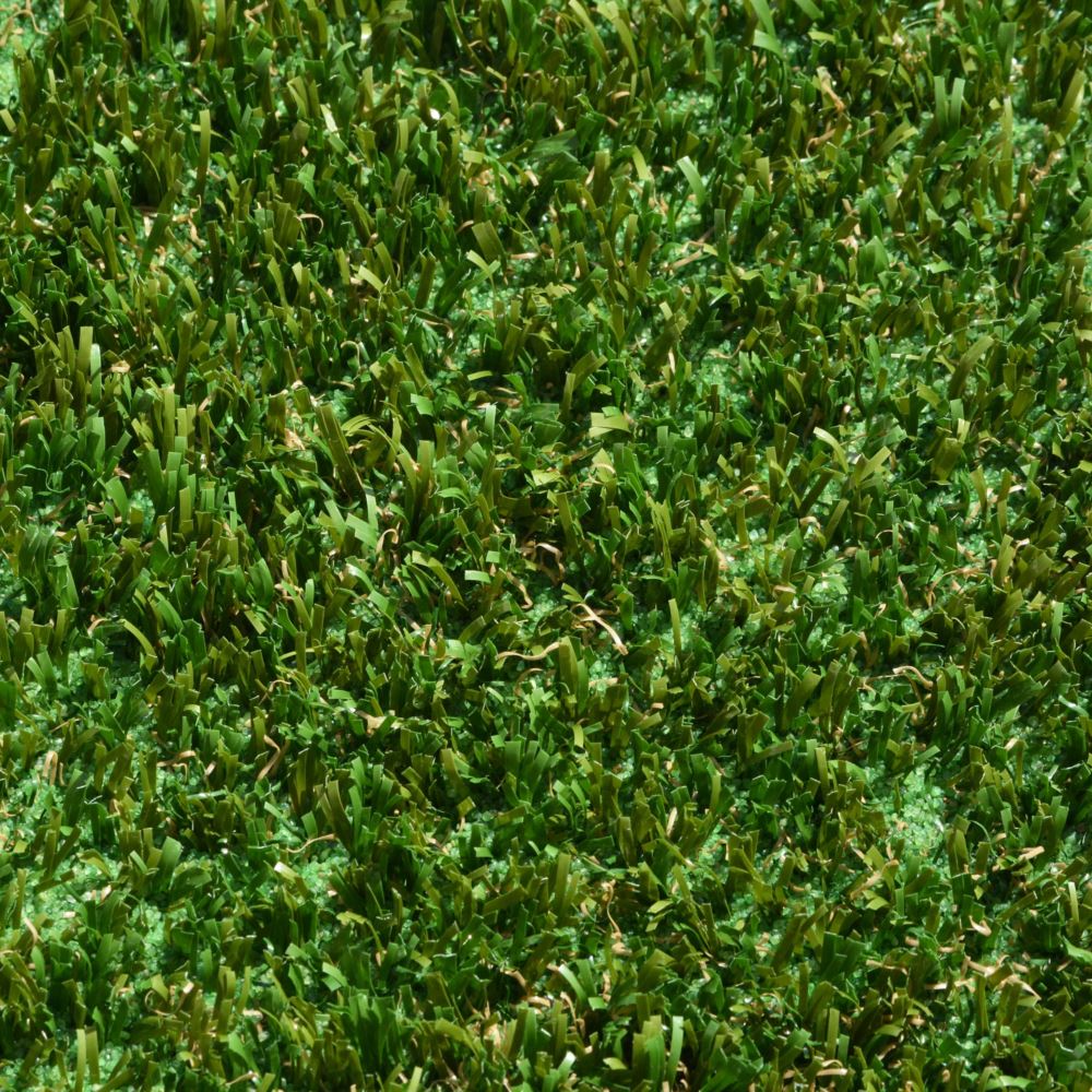 A close up shot of artificial turf designed for playgrounds featuring short green and brown grass strands A close up shot of artificial turf designed for playgrounds featuring short green and brown grass strands