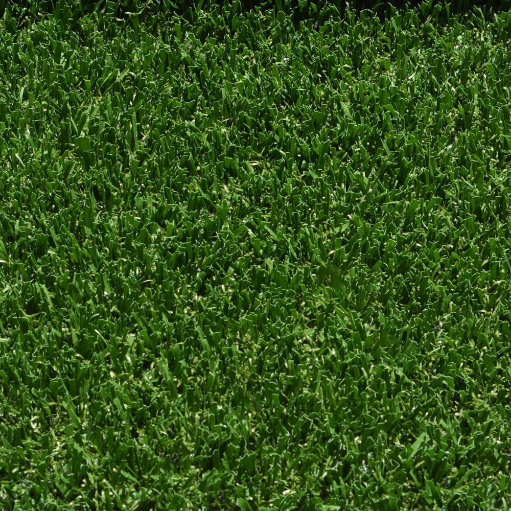 A close up shot of artificial turf designed for playgrounds featuring short green grass strands A close up shot of artificial turf designed for playgrounds featuring short green grass strands