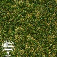 Close up image of artificial grass that is green with some brown strands.