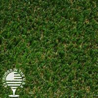 Close up image of green artificial grass with some brown fiber strands.