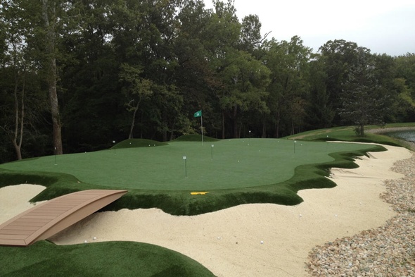 artificial putting green with natural surroundings