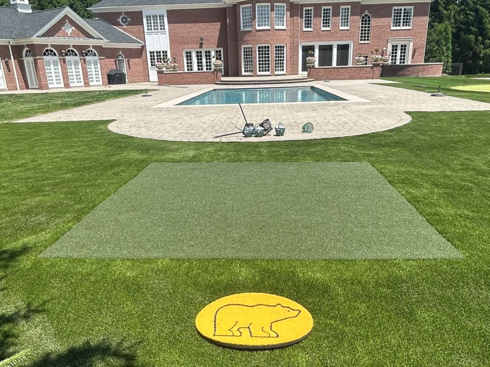 Golden bear logo and artificial grass golf hitting mat